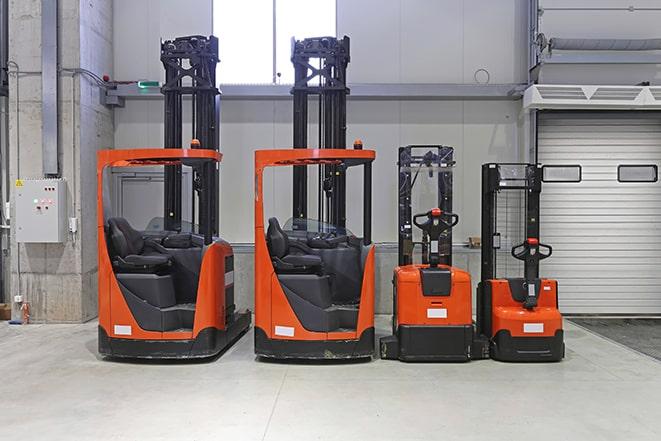 forklift fleet lined up at a distribution center